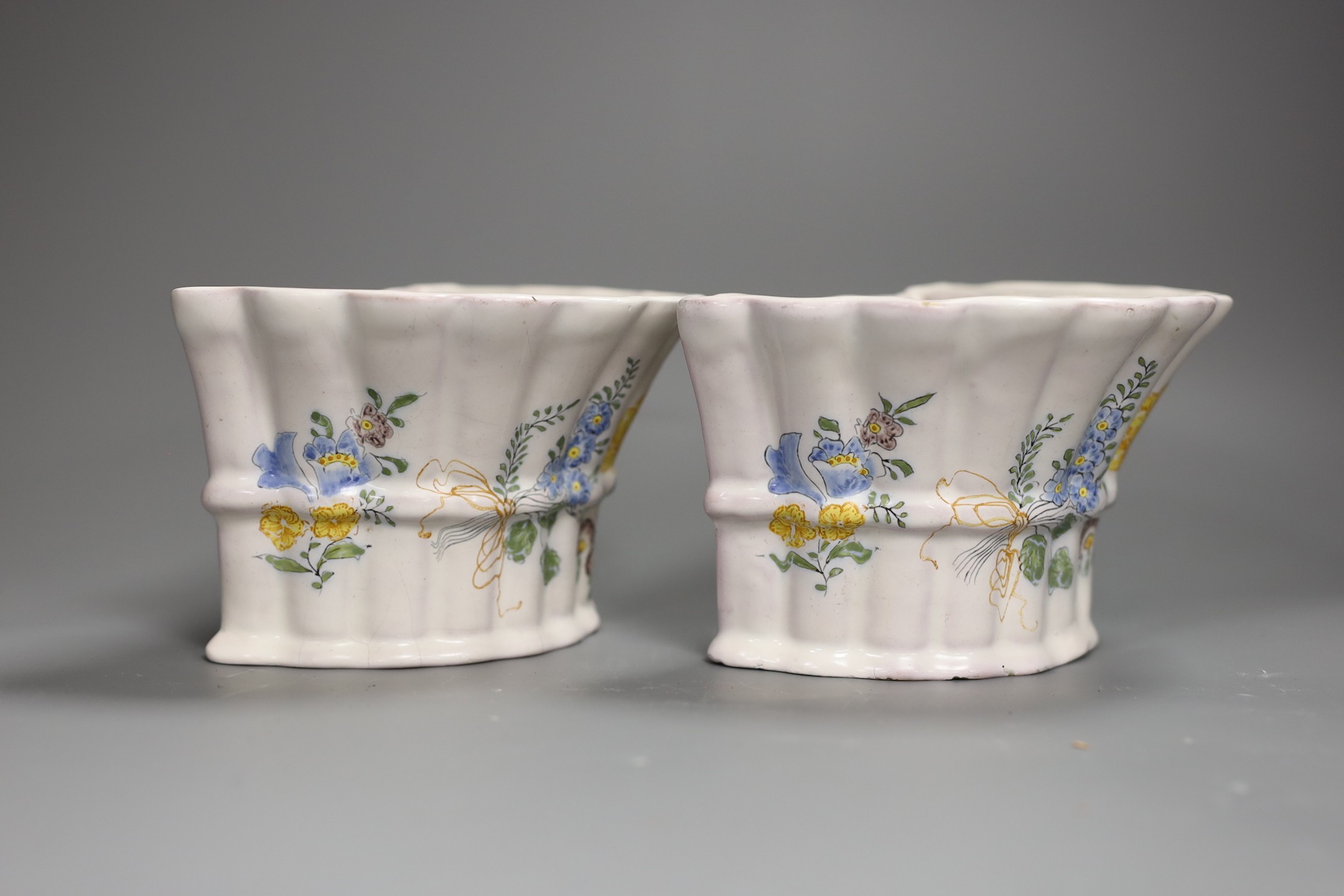 A pair of German faience flower decorated bough pots, late 18th century, 15.5cm wide